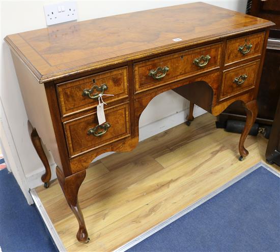 An early 18th century style walnut kneehole desk, W.108cm